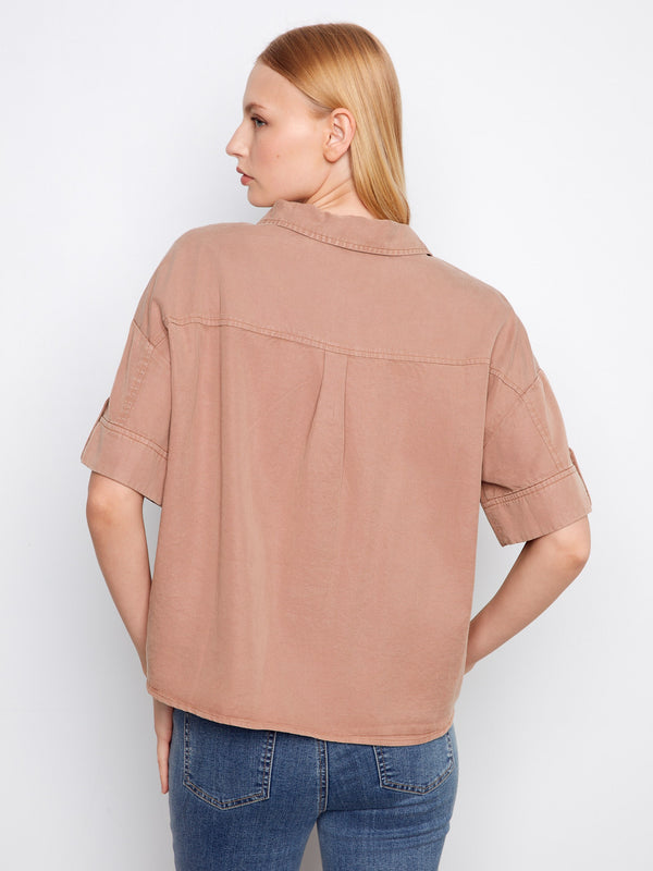 The button-front design of this chic shirt adds a touch of elegance to your everyday look by Charlie B.