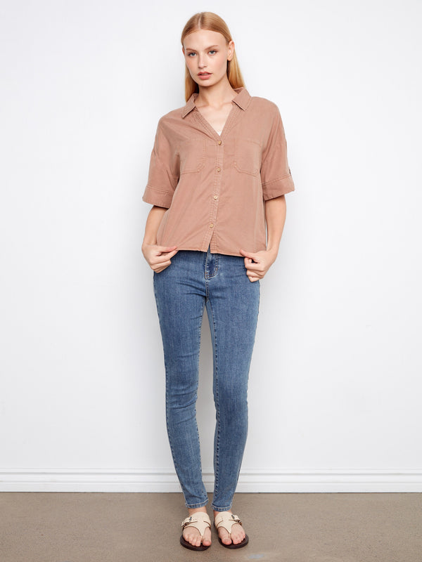 Complete with practical chest pockets, this fashionable top combines functionality with modern style by Charlie B.