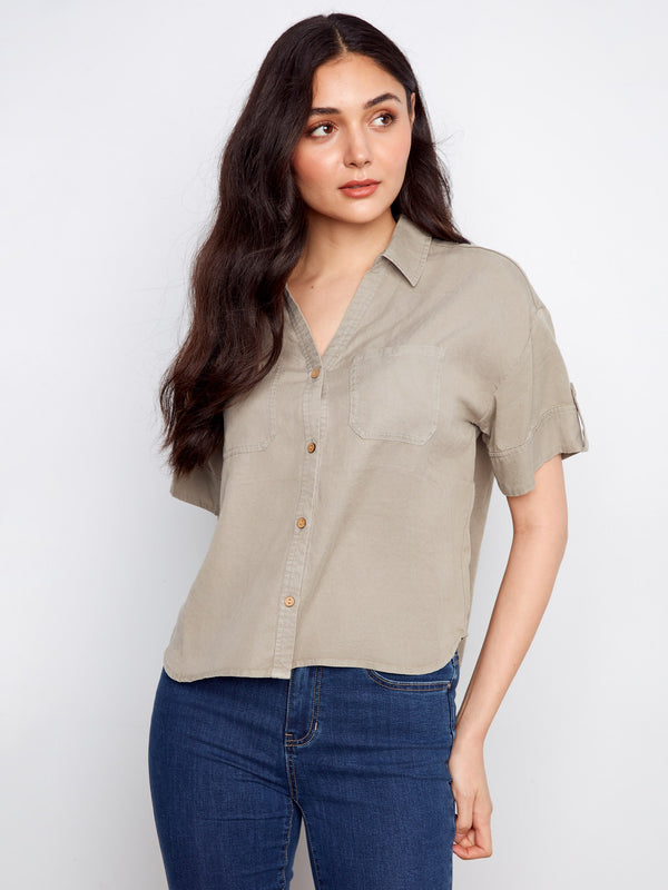 A chic shirt with convenient chest pockets, ideal for everyday wear and effortless style. By Charlie B.