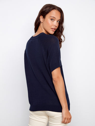 Chic navy top featuring an eye-catching strawberry motif and classic crew neckline, made from pure cotton for comfort by Charlie B.
