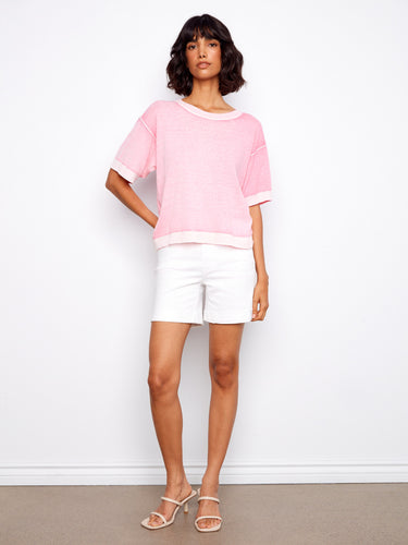 Stylish pink top with reverse print, crafted from 100% cotton for ultimate comfort. By Charlie B.