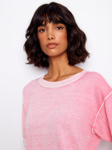 Elegant crew neck pink top, designed with a relaxed fit and soft cotton fabric. By Charlie B.