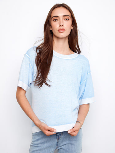 Crafted from 100% cotton, this blue sweater offers both style and breathability by Charlie B.