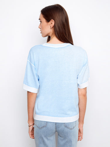 Relaxed fit blue short-sleeve sweater with subtle reverse print accents for versatile styling by Charlie B.