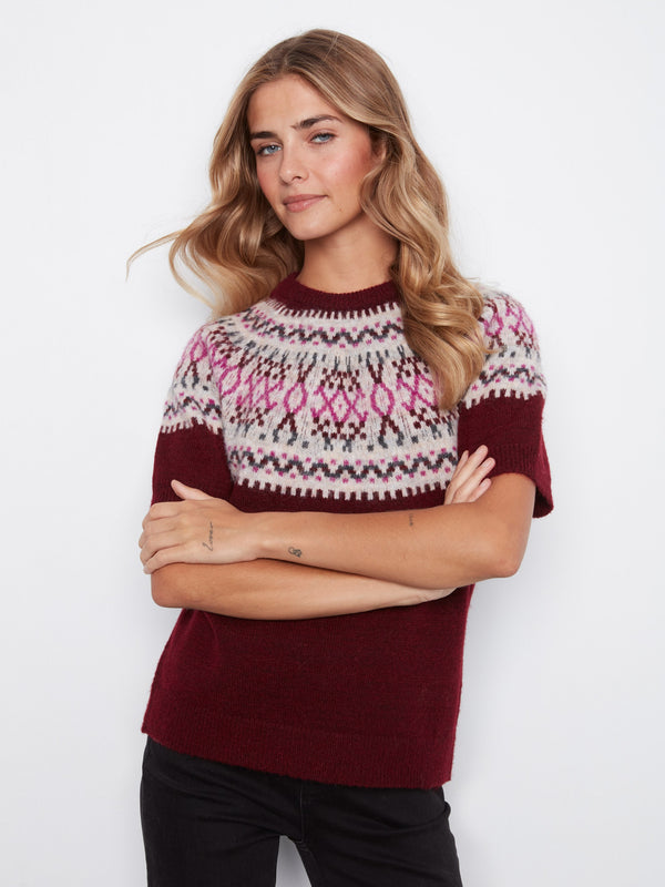 This sweater features a stylish crew neckline, adding a classic touch to its design. Perfect for casual outings or cozy days. By Charlie B.