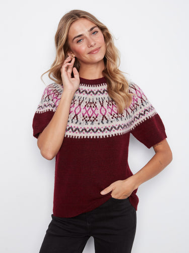 Crafted from soft brushed knit, this sweater ensures warmth and coziness during chilly days while maintaining style. By Charlie B.