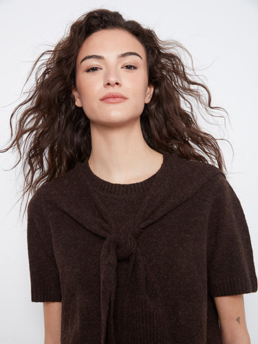 Adorned with an attached sweater detail, this top adds a touch of sophistication to any outfit by Charlie B.
