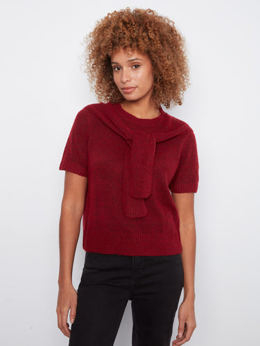 Red knit top with short sleeves and a cozy crew neckline, featuring an attached sweater detail for added style by Charlie B.