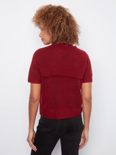 Stylish red garment showcasing a comfortable crew neckline and unique sweater detail for modern flair by Charlie B.