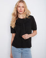 Black sweater with attached detail and a soft knit fabric, perfect for casual wear by Charlie B.