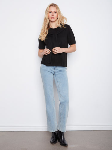 Stylish black sweater featuring a crew neckline and cozy knit texture by Charlie B.