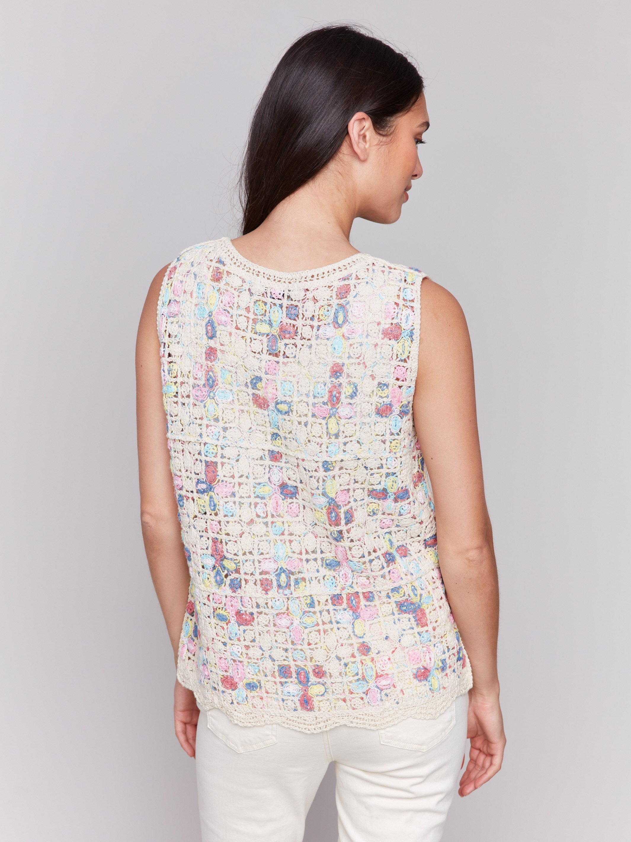 Elegant sleeveless design in natural tones by Charlie B.