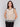 Natural color top with a crew neckline, perfect for any occasion by Charlie B.