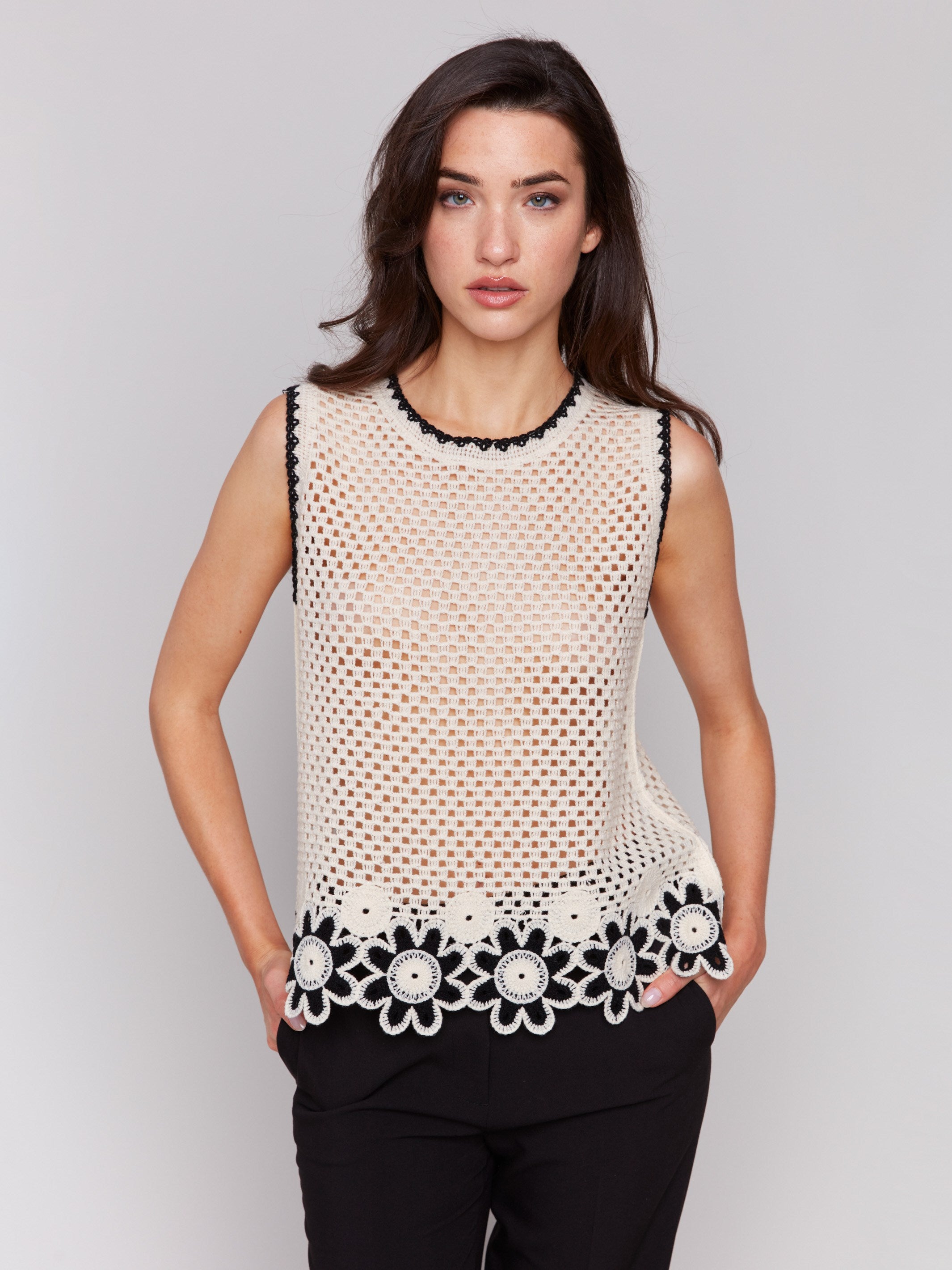 Crafted from 100% cotton, this crochet top offers comfort and style by Charlie B.