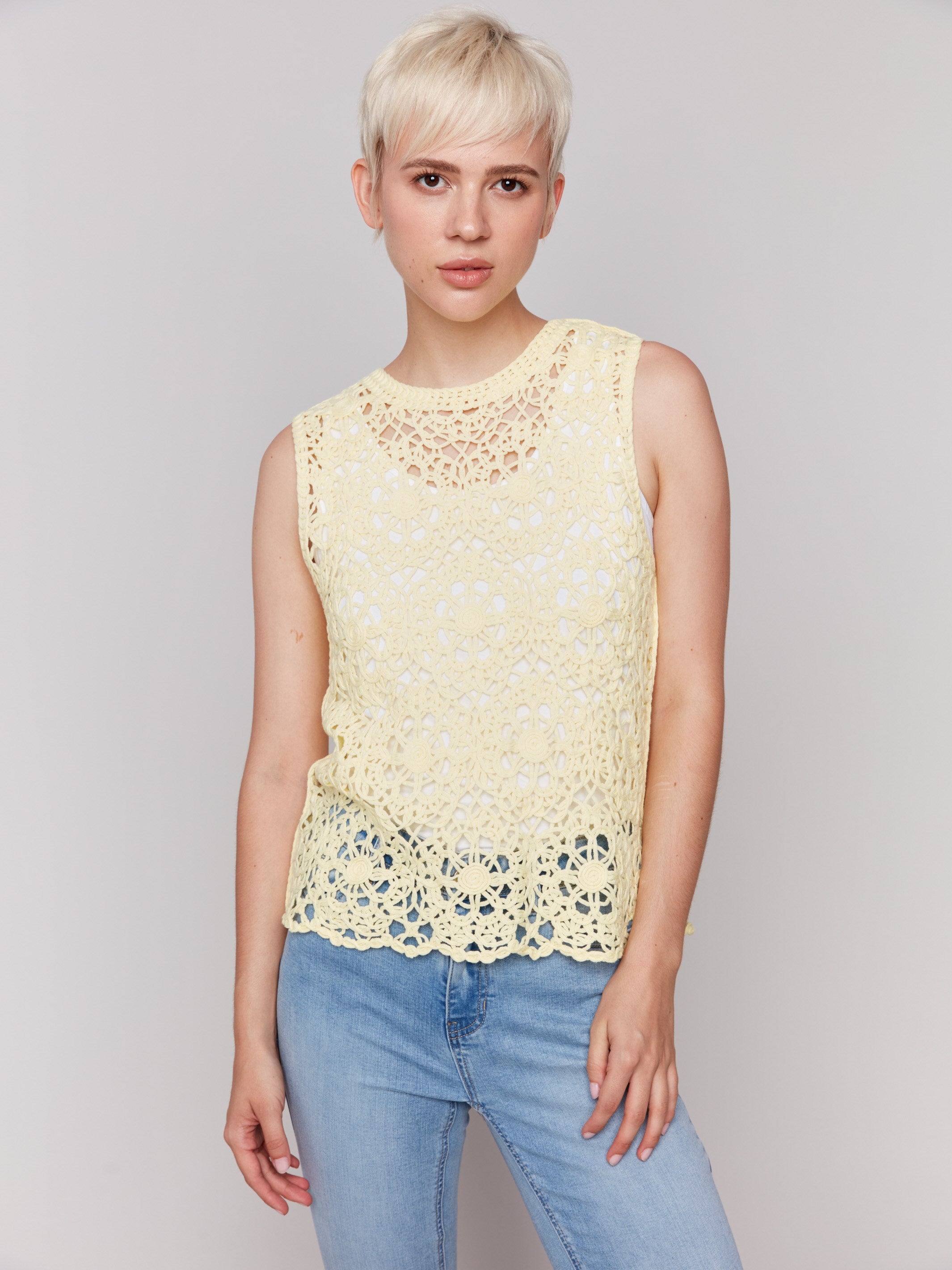 Elegant lemonade top with detailed floral crochet pattern by Charlie B.