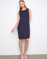 Navy sleeveless shift dress featuring a straight silhouette and decorative side button details by Charlie B.