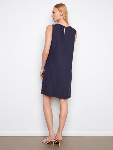 Elegant navy dress showcasing a crew neckline and stylish side button embellishments by Charlie B.