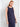 Sophisticated navy sleeveless dress with eye-catching side buttons, offering a sleek silhouette by Charlie B.