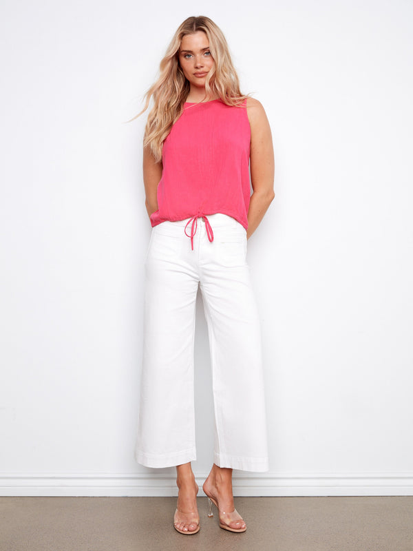 Chic pink top featuring a crew neckline, offering a modern look for any occasion. Its simplicity makes it versatile. By Charlie B.