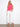 Casual yet trendy pink top with crew neckline and adjustable hem makes it suitable for various styles and settings. By Charlie B.