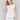 White linen blend top with a crew neckline, offering a breezy style by Charlie B.
