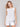 White linen blend top with a crew neckline, offering a breezy style by Charlie B.