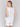 Elegant sleeveless design in white linen blend by Charlie B.