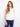 White linen top with sophisticated high-low hem and button details by Charlie B.