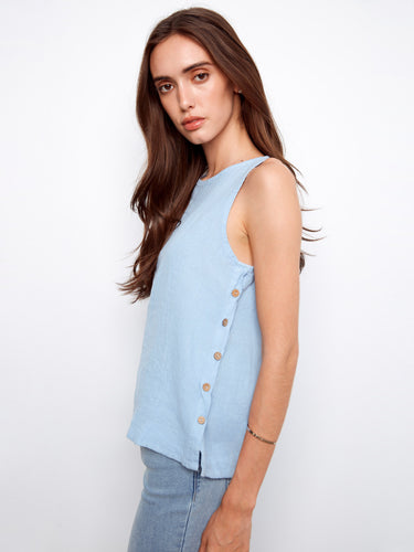 Elegant sleeveless design in light fabric, highlighted by button detailing along the side for added flair. By Charlie B.