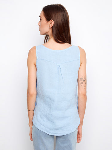 Soft and airy blue top with a unique high-low hemline, perfect for layering or wearing alone on warm days. By Charlie B.