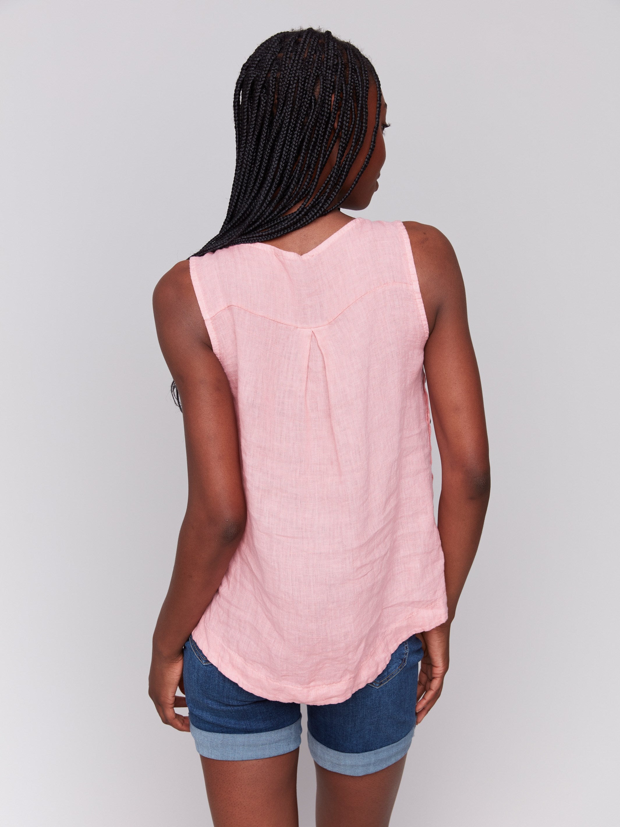 Chic crew neckline on a guava linen tank top by Charlie B.
