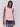 Fashion-forward high-low hem and sleeveless style in guava by Charlie B.