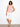 Elegantly designed with a high-low hem, this sleeveless top offers both style and comfort in a subtle pink hue by Charlie B.