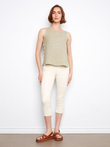 Embrace the sleeveless design of this linen top, offering effortless style and ease for summer outings. By Charlie B.