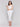 Chic sleeveless design in white linen by Charlie B.