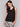 Elegant sleeveless design in black linen by Charlie B.