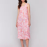 Flowy silhouette dress with a papaya tie-dye pattern by Charlie B.