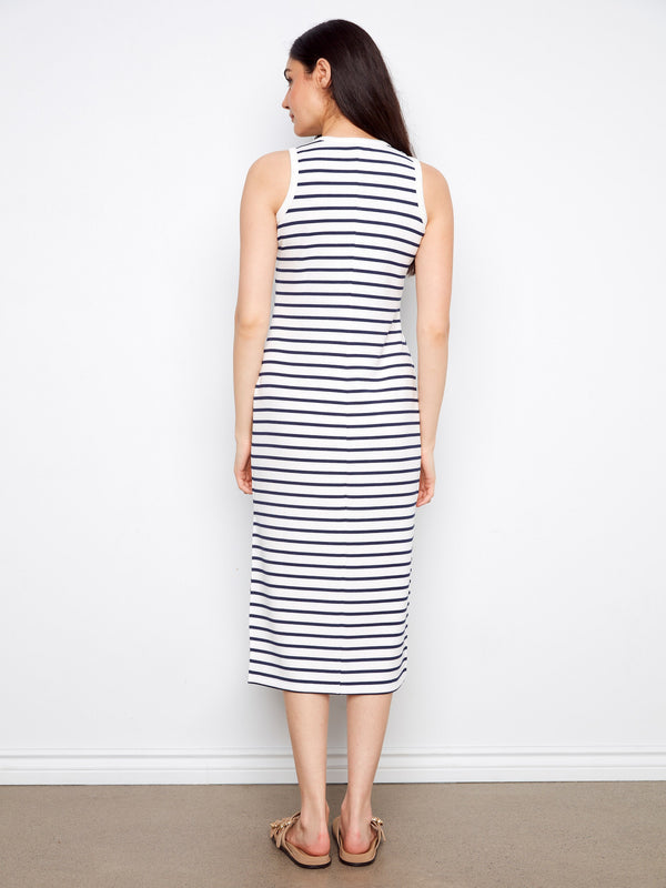 This striped dress features a classic crew neckline, offering timeless style and versatility for any occasion. By Charlie B.