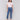 Pull-on style medium blue jeans with floral accents by Charlie B.