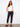Black slim-fit pants with stretch twill fabric and a belt, ideal for comfort and style by Charlie B.