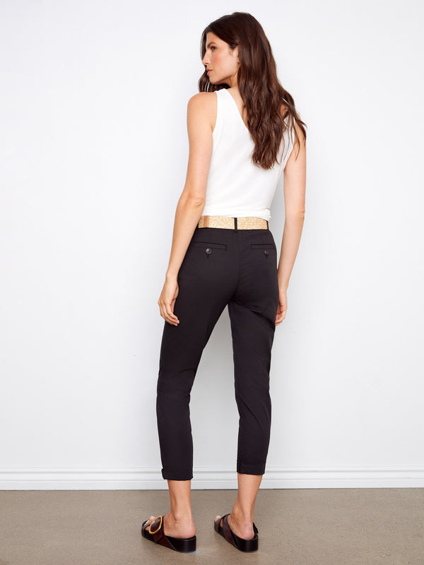 Black pants with narrow legs and slash pockets, crafted in stretch twill fabric by Charlie B.