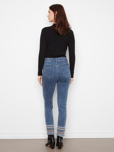 Crafted in premium stretch denim for comfort, these medium blue slim-leg jeans feature unique embroidery accents by Charlie B.