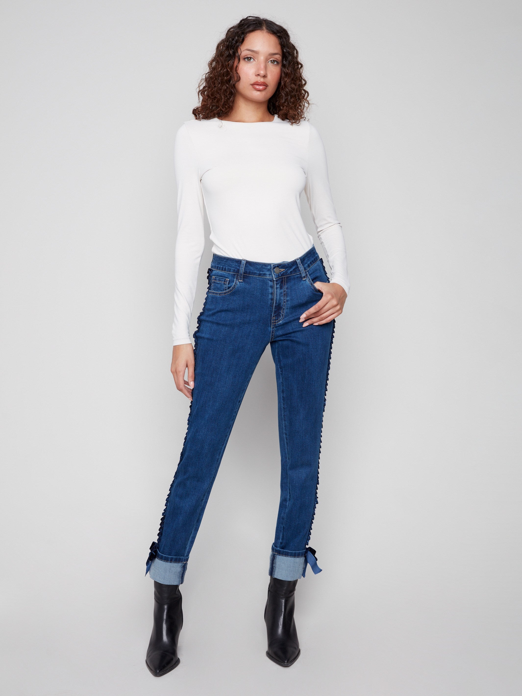 Indigo jeans featuring a stylish slim fit and folded hem, perfect for a chic look by Charlie B.