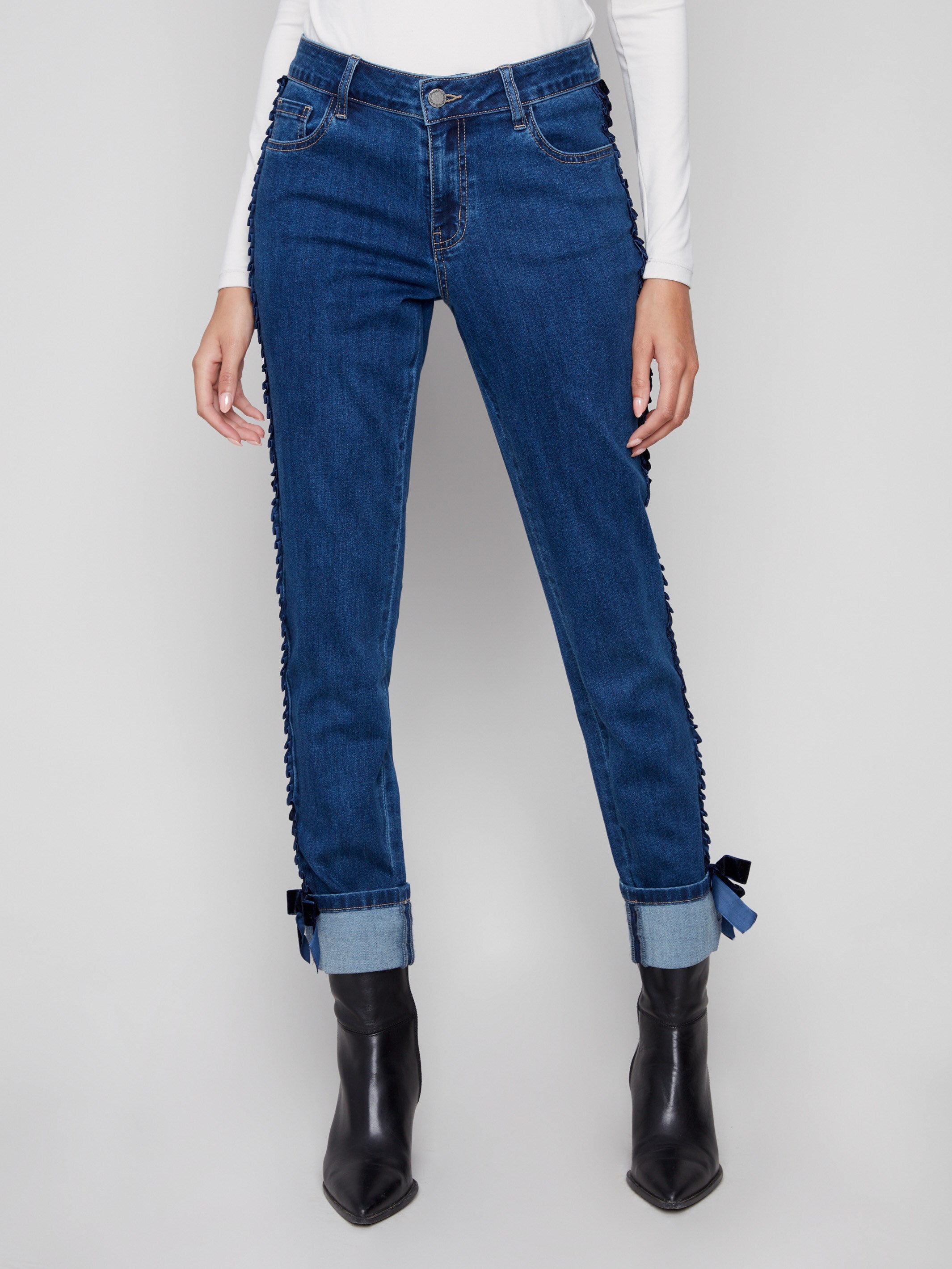 Stretch denim fabric in indigo with a regular rise and five-pocket design for comfort and style by Charlie B.