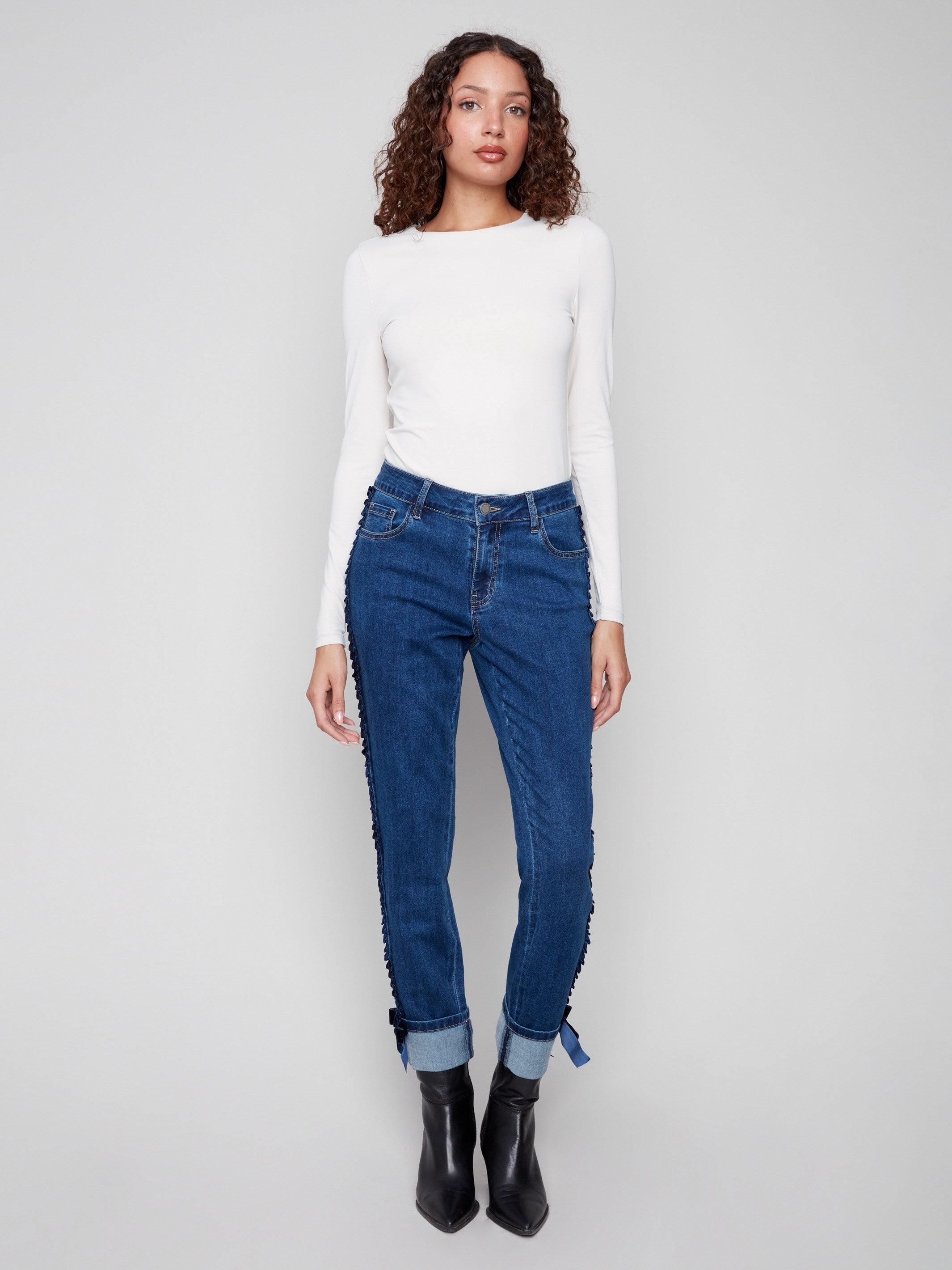 Indigo jeans showcasing a trendy five-pocket design, ideal for versatile styling options by Charlie B.
