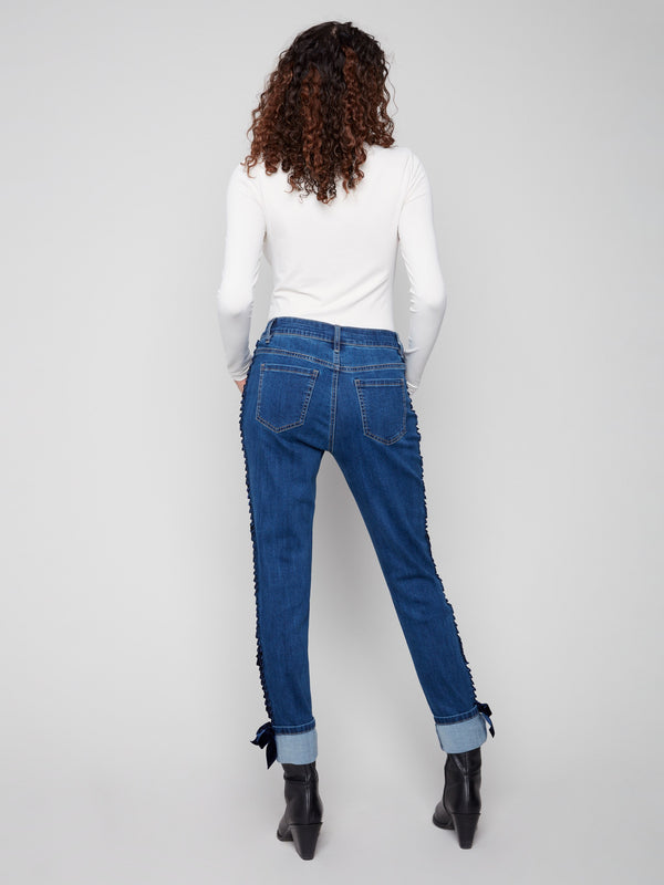 Indigo denim jeans designed with five-pocket styling, ensuring both practicality and style by Charlie B.