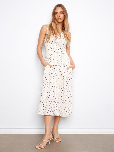 Polka dot midi dress with hidden pockets and a flattering smocked waist by Charlie B.