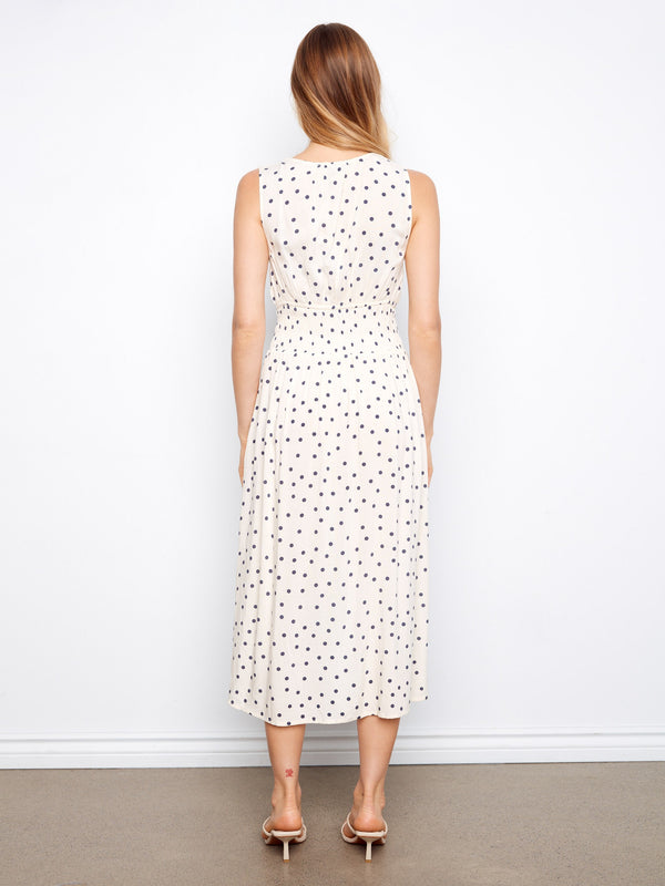 Elegant white polka dot dress with wide straps, perfect for any occasion by Charlie B.