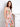 The midi length of this dress offers versatility, making it suitable for various occasions with its lovely floral pattern by Charlie B.