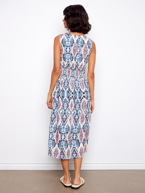 The elegant midi length of this dress is complemented by its detailed print, making it versatile for various events. By Charlie B.